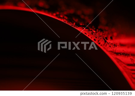 Red reflections of liquid in macro, red liquid panels, bubbles in macro, connection of bubbles in macro, cell from liquid, horror black background 120935139