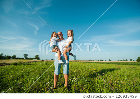 dad and two kids.Nature, blue sky, family rest dad and two kids.Nature, blue sky, family rest 120935459