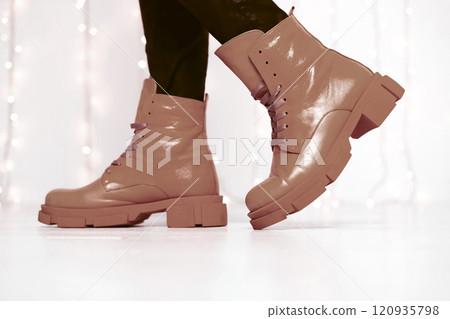 Crop woman in stylish   boots. Trendy colors of the year 120935798