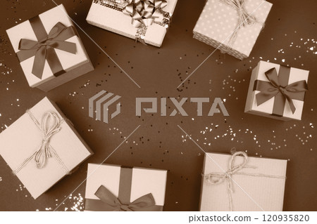 Beautifully wrapped gift boxes with ribbons on festive background Beautifully wrapped gift boxes with ribbons on festive background 120935820
