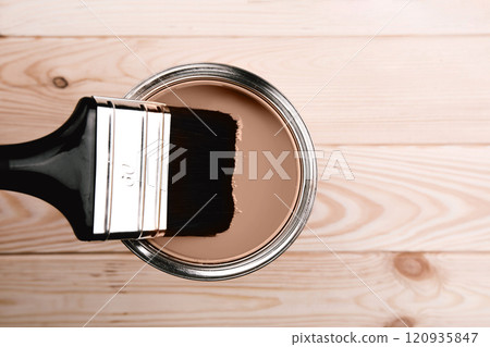 Paintbrush dipped in brown paint on light wooden background showing texture Paintbrush dipped in brown paint on light wooden background showing texture 120935847