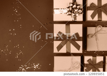 Elegant gift boxes with bows showcased on a sparkling festive background 120935851