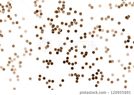 Brown confetti scattered on a white background for festive celebrations 120935891