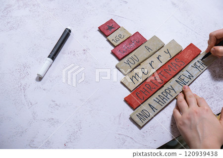 Wooden Christmas tree Gift idea. Do it yourself instruction eco-friendly decoration. Zero waste Making handmade presents children's diy projects. Holiday family time Wooden Christmas tree Gift idea. Do it yourself instruction eco-friendly decoration. Zero waste Making handmade presents children's diy projects. Holiday family time 120939438