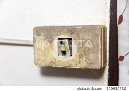 Old broken electrical socket fell out of box. Old broken electrical socket fell out of box. 120939588