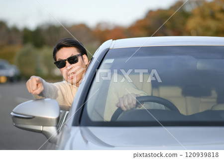 Angry man driving a car 120939818