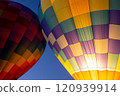 Hot air balloons lift off into the dawn sky 120939914