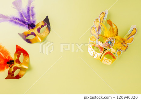 Happy Purim carnival accessories. Top view carnival mask for Mardi Gras celebration isolated on pastel green background, jewish holiday, Purim in Hebrew holiday 120940320