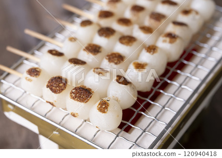 Grilling skewers of rice dumplings on a charcoal grill Grilling mitarashi rice dumplings 120940418