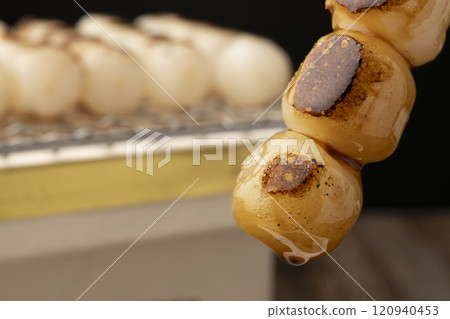 Mitarashi dango: Grilled dumplings dipped in sauce Mitarashi dango: Grilled dumplings dipped in sauce 120940453