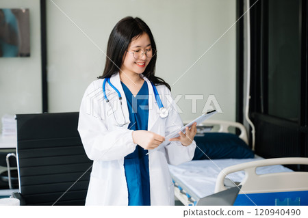 Beautiful physician doctor sit on table in office hospital. Attractive therapist female practitioner pharmacist smile 120940490