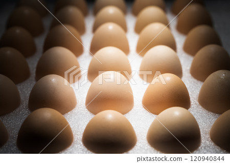 close up of brown eggs in a carton box 120940844