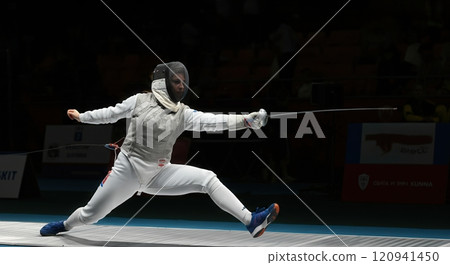 Dynamic fencing duel in action, en garde stance, sports photography for editorial use 120941450