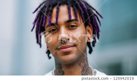 Urban style portrait of a young man with purple dreadlocks and facial piercings diversity and self-expression in modern fashion 120942019