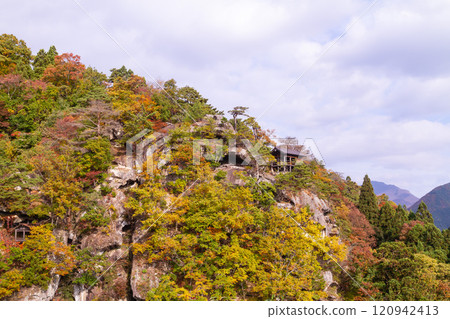 Autumn leaves growing on the cliffs of Yamadera Temple - a view from Godaido Hall Autumn leaves growing on the cliffs of Yamadera Temple - a view from Godaido Hall 120942413