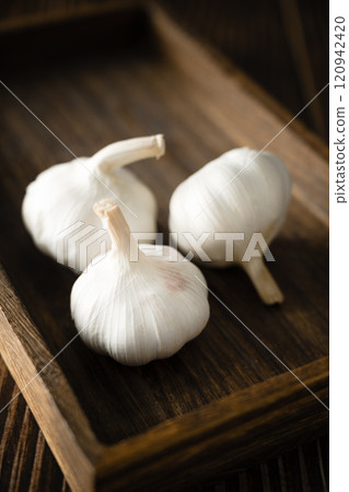 garlic on a wooden vintage background garlic on a wooden vintage background 120942420