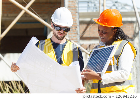 Professional - senior civil engineers inspecting or working in construction site, contractor examining a building blueprint or layout on paper. Professional - senior civil engineers inspecting or working in construction site, contractor examining a building blueprint or layout on paper. 120943210