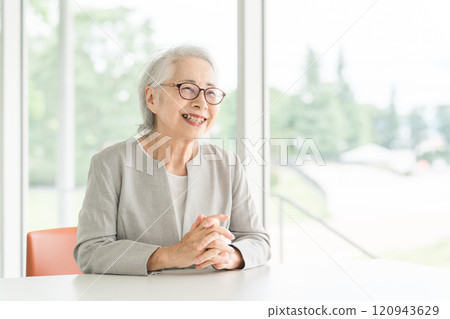 Senior/elderly woman being interviewed (active senior) Senior/elderly woman being interviewed (active senior) 120943629