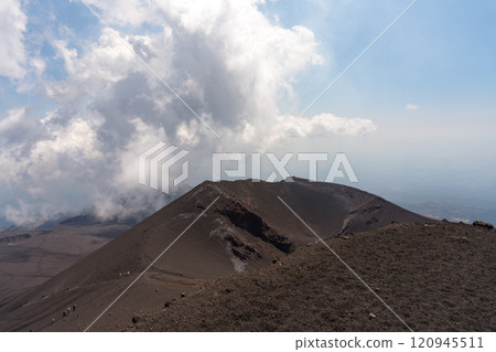 Volcanic peak and spreading clouds of Mt. Etna, Italy Volcanic peak and spreading clouds of Mt. Etna, Italy 120945511