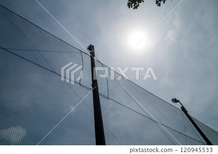 Baseball net, lighting and sunlight 120945533