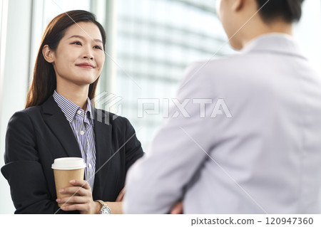 young asian businesswomen chatting in office 120947360