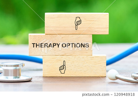 Building awareness of therapy options with wooden blocks and medical tools in a healthcare setting 120948918