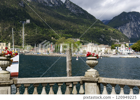 Lake Garda with mountains in background, view from Riva del Garda town shore, Italy, Europe. 120949225