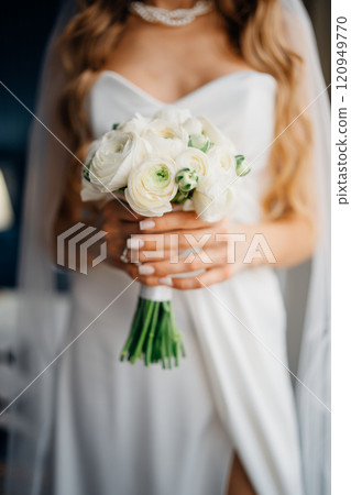 without a face. The bride with a bouquet in simple elegant wedding dress without a face. The bride with a bouquet in simple elegant wedding dress 120949770