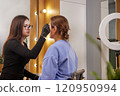 Eyebrow Expert, Professional Microblading, Salon Procedure. Woman is at beauty salon, undergoing sophisticated eyebrow correction procedure that includes microblading and smudge repair. 120950994