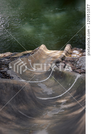 Slider ramp down surrounded by nature for Playing in the stream. 120951077
