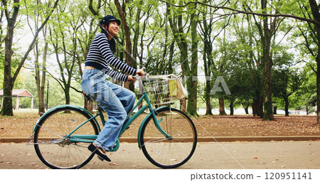 Nature, fitness and woman with bicycle, travel and commuting in city road or transport for student. Outdoor, active and girl with bike for trip, cyclist and tourism of national park, cycling or Japan 120951141