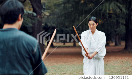 People, fitness and sword in park for martial arts, demonstration or combat start in Kyoto. Japanese kendo, teacher or outdoor with bamboo shinai for lesson, culture heritage or traditional challenge 120951151