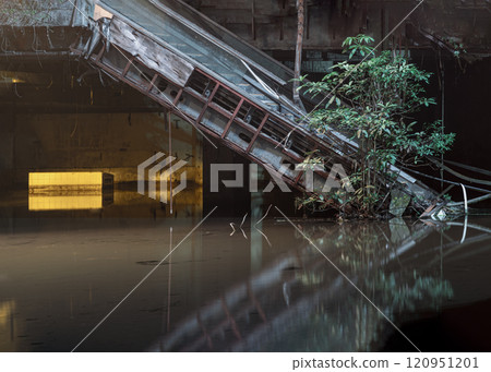 Dramatic view of Damaged escalators inside Abandoned new world shopping mall building by rain flood water. Dramatic view of Damaged escalators inside Abandoned new world shopping mall building by rain flood water. 120951201