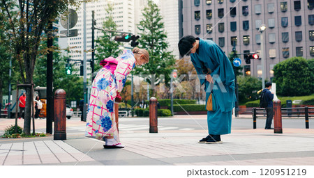 Respect, japanese people and bow for greeting, culture and welcome with kimono in city. Traditional fashion, man and woman with introduction in urban town for honor, departure and farewell custom 120951219