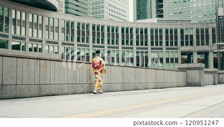 City, walking and woman on sidewalk with kimono, morning commute and traditional clothes from back. Explore, discover and girl with Japanese fashion, culture or urban street on travel adventure City, walking and woman on sidewalk with kimono, morning commute and traditional clothes from back. Explore, discover and girl with Japanese fashion, culture or urban street on travel adventure 120951247