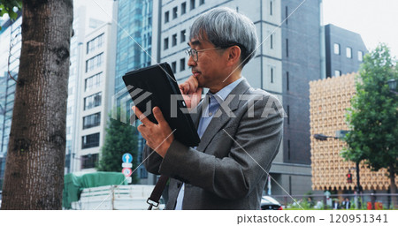 Businessman, tablet and thinking in city for research, communication or networking client with idea. Japanese person, technology and mature architect for planning, development or proposal with vision Businessman, tablet and thinking in city for research, communication or networking client with idea. Japanese person, technology and mature architect for planning, development or proposal with vision 120951341