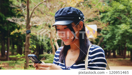 App, phone and smile with woman in park for adventure, sightseeing or travel to explore Japan. Map, social media and walking with happy tourist person outdoor in nature to search for directions App, phone and smile with woman in park for adventure, sightseeing or travel to explore Japan. Map, social media and walking with happy tourist person outdoor in nature to search for directions 120951465
