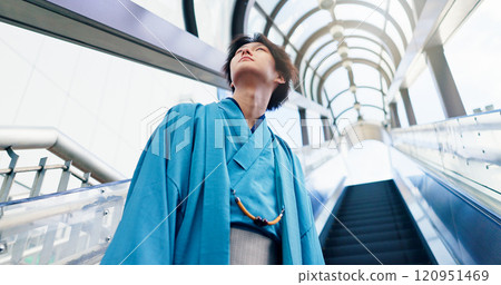 Japanese man, thinking and escalator with traditional clothes, outfit and yukata for heritage. Guy, metro and holiday for culture, journey and sightseeing with casual dress kimono fashion in city 120951469