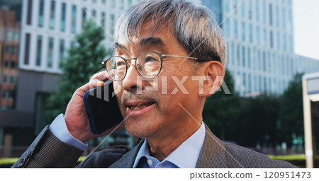 Outdoor, businessman and conversation on phone call in city for contact and communication in Japan. Mature person, employee and closeup on discussion or networking for urban development and growth Outdoor, businessman and conversation on phone call in city for contact and communication in Japan. Mature person, employee and closeup on discussion or networking for urban development and growth 120951473