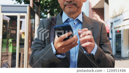 Cellphone, hands and businessman in city for communication, email or networking with online investor. Technology, contact and finance executive with phone for company revenue report in town in Japan. 120951486