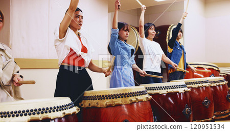 Japanese, drums and women in performance for music on instrument for stage practice, creativity or talent. Taiko, people and female drummers in band to play in rehearsal for culture, rhythm or beat Japanese, drums and women in performance for music on instrument for stage practice, creativity or talent. Taiko, people and female drummers in band to play in rehearsal for culture, rhythm or beat 120951534