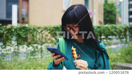 Reading, student and woman with smartphone, snack and browsing of timetable for exam, eating and campus. Outdoor, education and Asian person with food, scroll and check of schedule, mobile and Japan Reading, student and woman with smartphone, snack and browsing of timetable for exam, eating and campus. Outdoor, education and Asian person with food, scroll and check of schedule, mobile and Japan 120951676