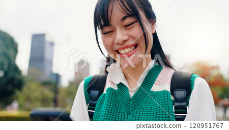 Smile, phone and text of Japanese woman in city with social media, happy and web scroll outdoor. University, campus and college student with morning commute, travel and mobile networking in park 120951767