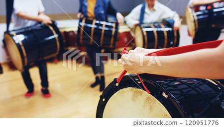 People, hands and drum in studio for music, rehearsal and traditional rhythm in Japan. Taiko, musician group and practice in academy class for learning culture, heritage appreciation or demonstration 120951776