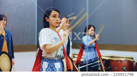 Japanese, learning and people with drums for music on instrument for performance, practice and class. Taiko, women or female drummers in band to play in group rehearsal for culture, rhythm or beat Japanese, learning and people with drums for music on instrument for performance, practice and class. Taiko, women or female drummers in band to play in group rehearsal for culture, rhythm or beat 120951796