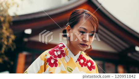 Bow, culture and woman at temple with kimono, fashion and waiting at outdoor building with respect. Style, design and confident girl with traditional Japanese clothes, greeting and hostess at pagoda 120951842