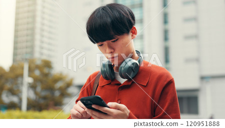 Phone, streaming and online with Japanese man in college for student portal, education and University website. Social media, networking and research with person in outdoor of japan for app and chat 120951888