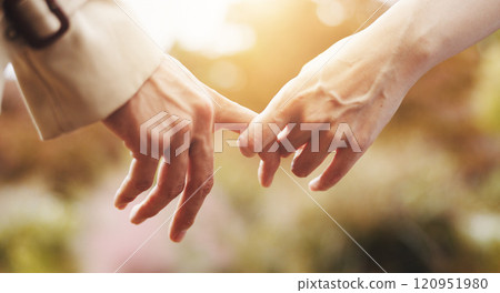 Love, closeup and holding hands with couple in park for romance, bonding and relationship. Support, care and trust with people in Japan nature date for connection, commitment and peace together 120951980