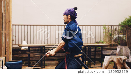 Culture, dojo and sword with Samurai man in Japan for combat, martial arts or training, Fighting, Kenjutsu and weapon with Japanese person in kendogi for discipline, exercise or practice routine Culture, dojo and sword with Samurai man in Japan for combat, martial arts or training, Fighting, Kenjutsu and weapon with Japanese person in kendogi for discipline, exercise or practice routine 120952359