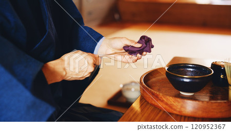 Man, matcha and tea ceremony in Japan for tradition, culture and relax in home with preparation. Male person, ritual and bowl for mindfulness, zen and buddhism with spiritual, respect and harmony 120952367